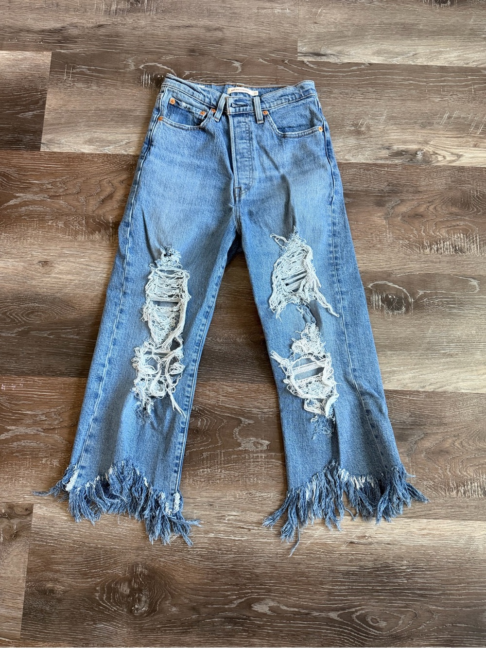 Levi's Light Blue Distressed Flare Jeans with Fringe Hem